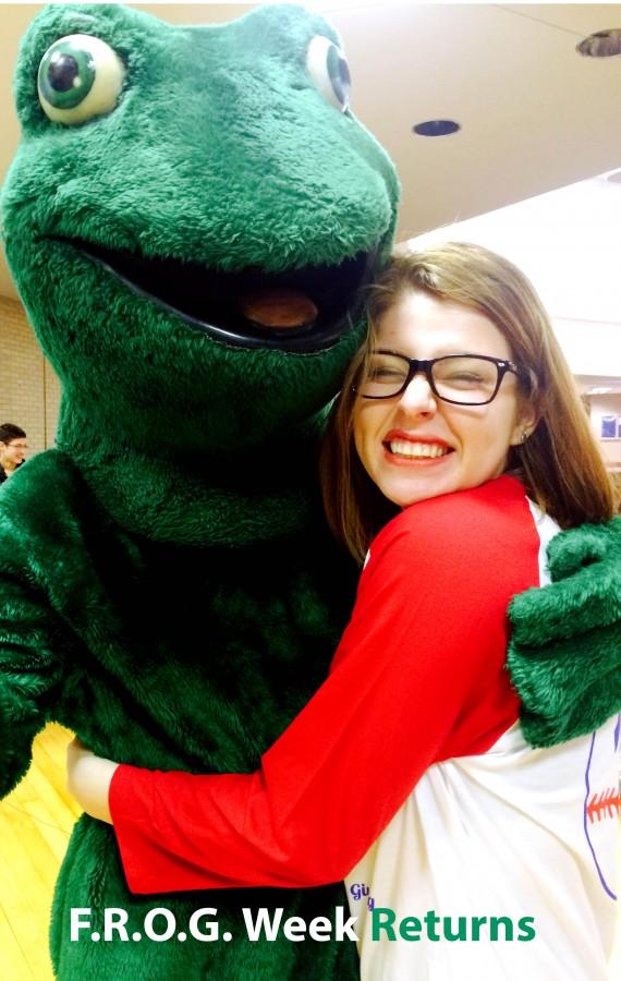 Brittnee+Tapia+hugging+the+Frog+and+showing+her+Summit+Love.+In+the+cafeteria+February+20%2C2015